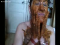 Extremely messy scat movie depicts brunette smearing poop on herself